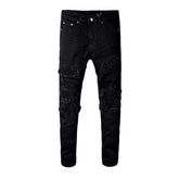 Vaqueros biker ajustados con parches negros